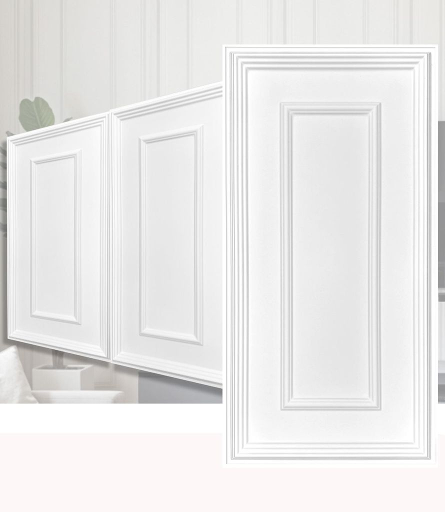 Close-up view of white cabinet doors with decorative paneling.