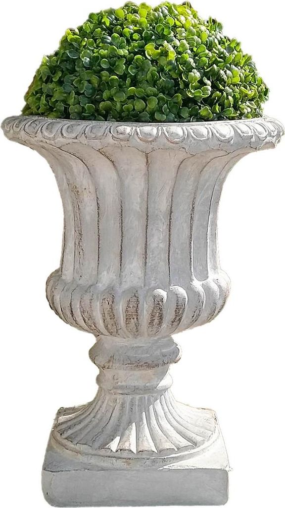 A decorative planter with a green plant.