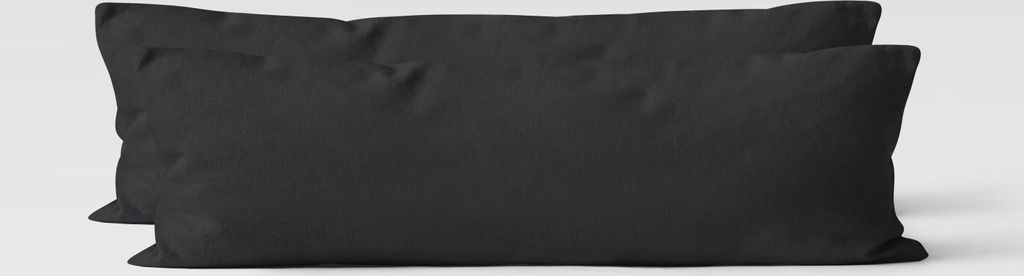Two black rectangular pillows are shown side-by-side against a light gray background.