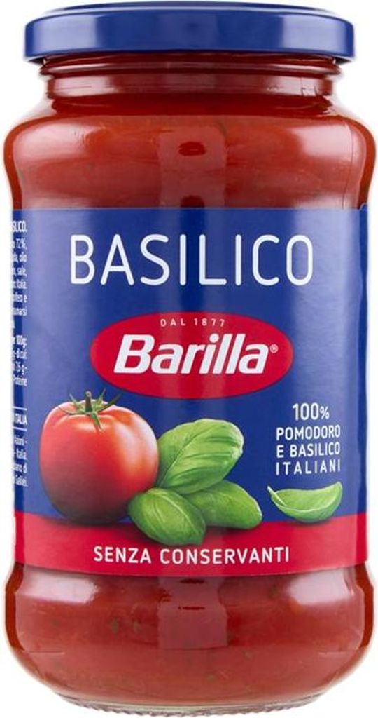 A jar of Barilla basil sauce against a white background.