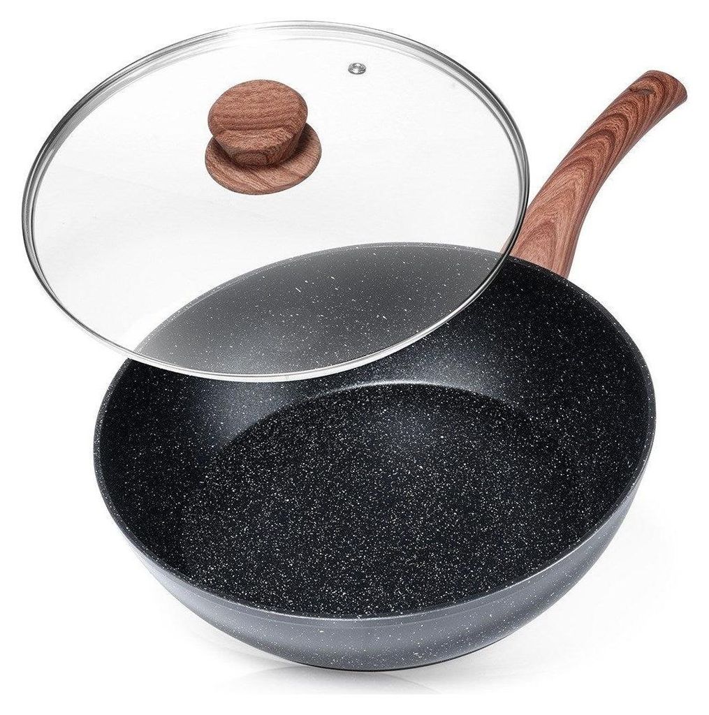 A black granite wok with a wooden handle and a clear glass lid.
