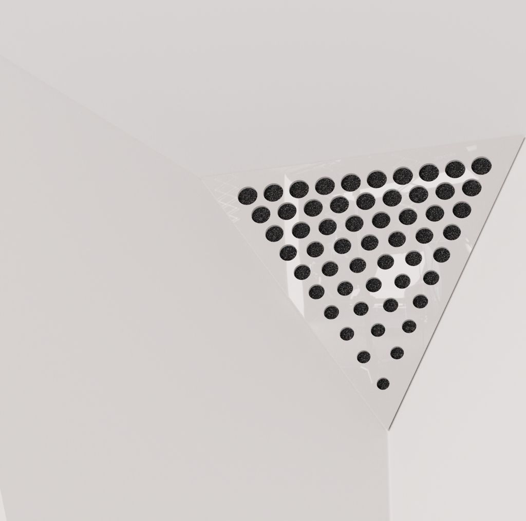 A close-up view of a white triangular acoustic foam panel with a perforated surface, designed for corners.