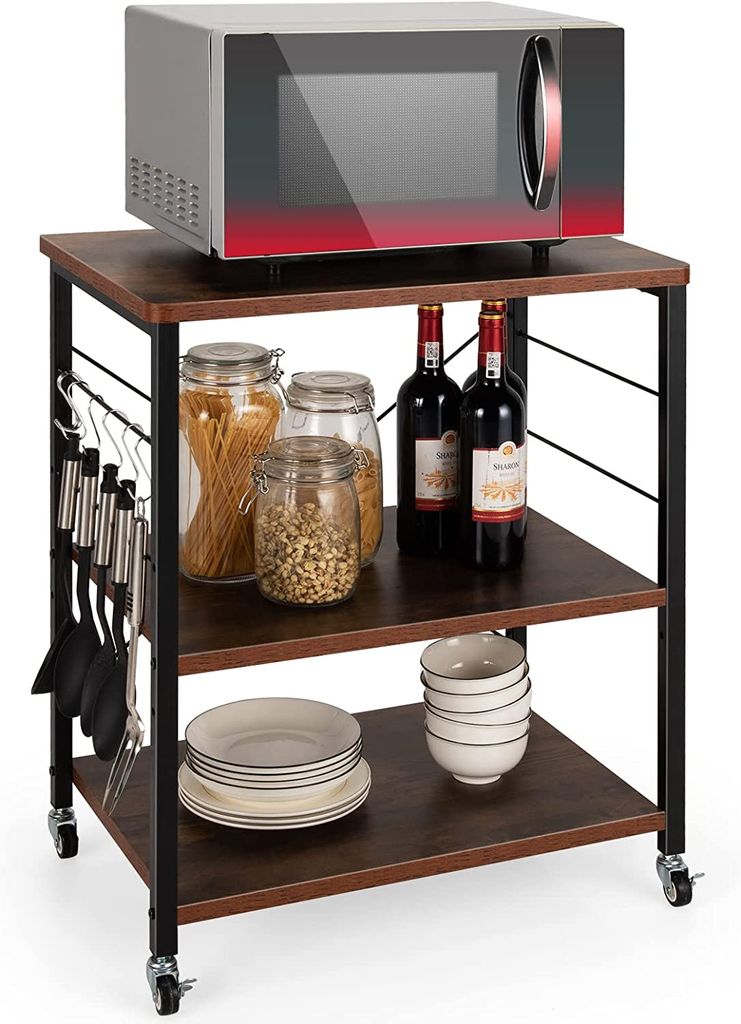 A three-tier kitchen cart with a microwave on top and various kitchen items on the shelves.