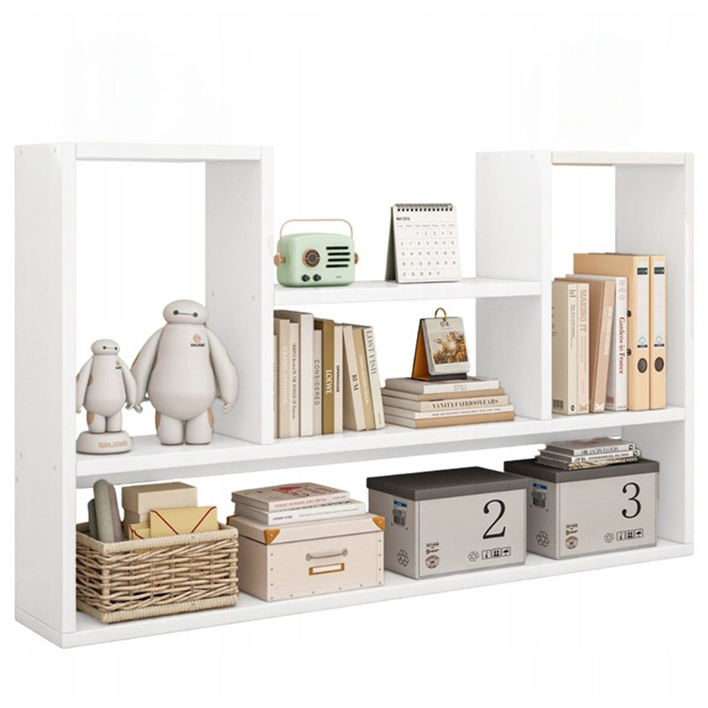 A white shelf unit displaying various decorative items and storage boxes.