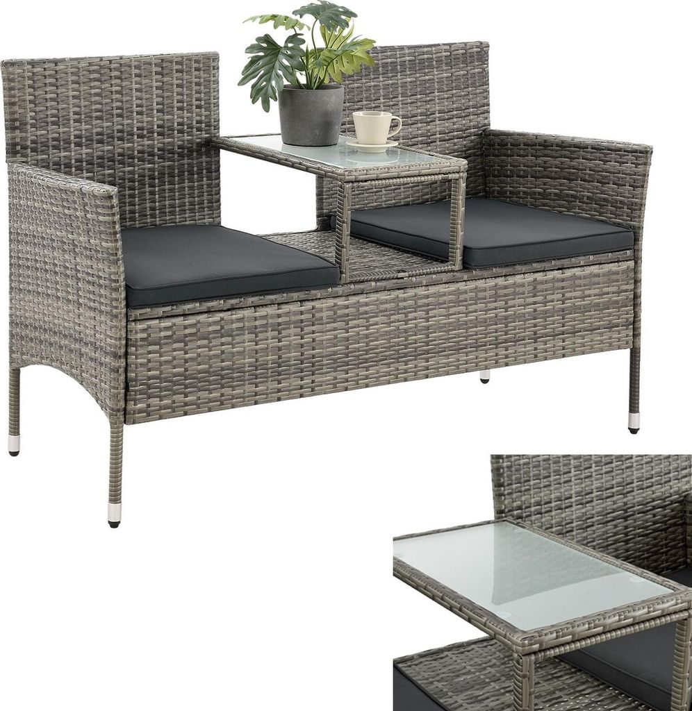 A grey rattan garden bench with a built-in table, a plant, and a cup on it, shown against a white background.