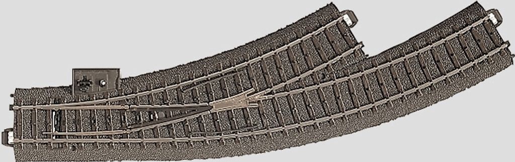 A model railway track switch (Bogenweiche) with a mechanism for changing the track direction.