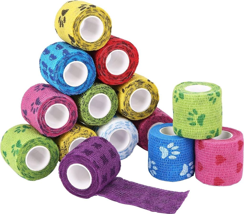 A pile of colorful self-adhesive bandages with paw print patterns.