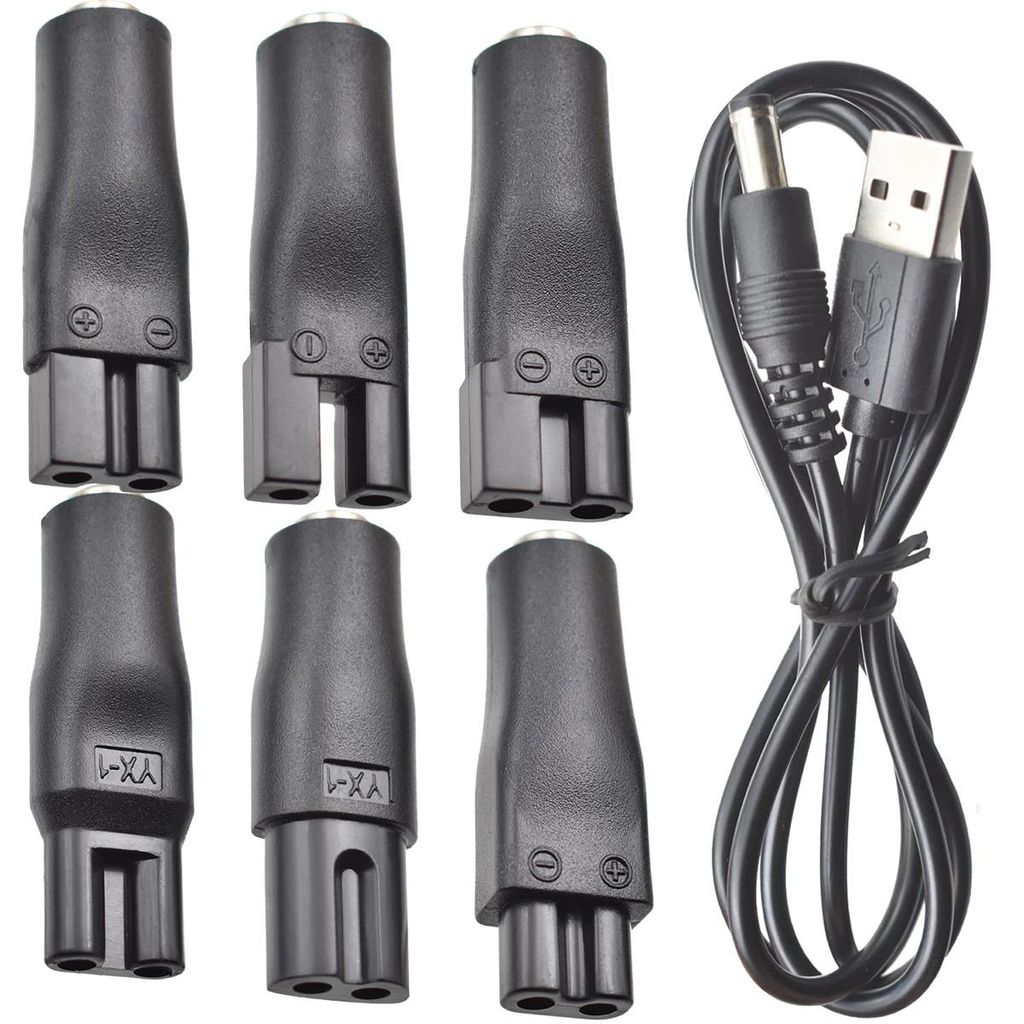 A set of electronic adapters and a USB cable are arranged on a white background.