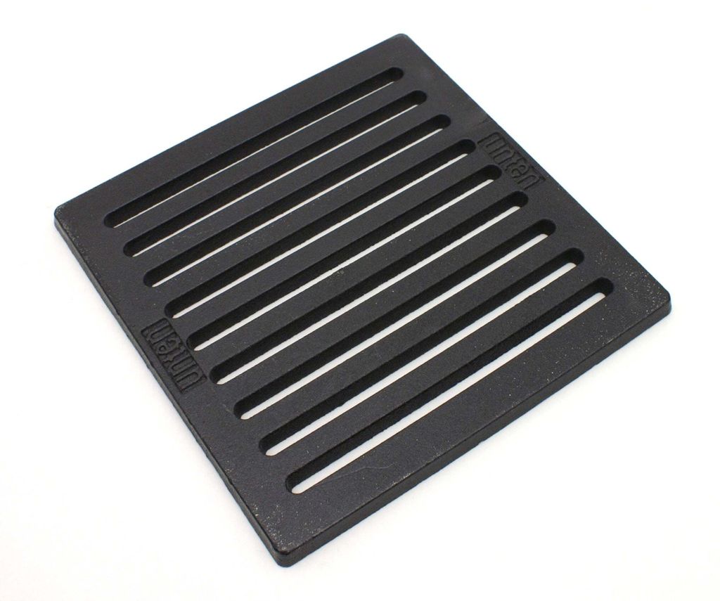 A black cast iron grate on a white background.