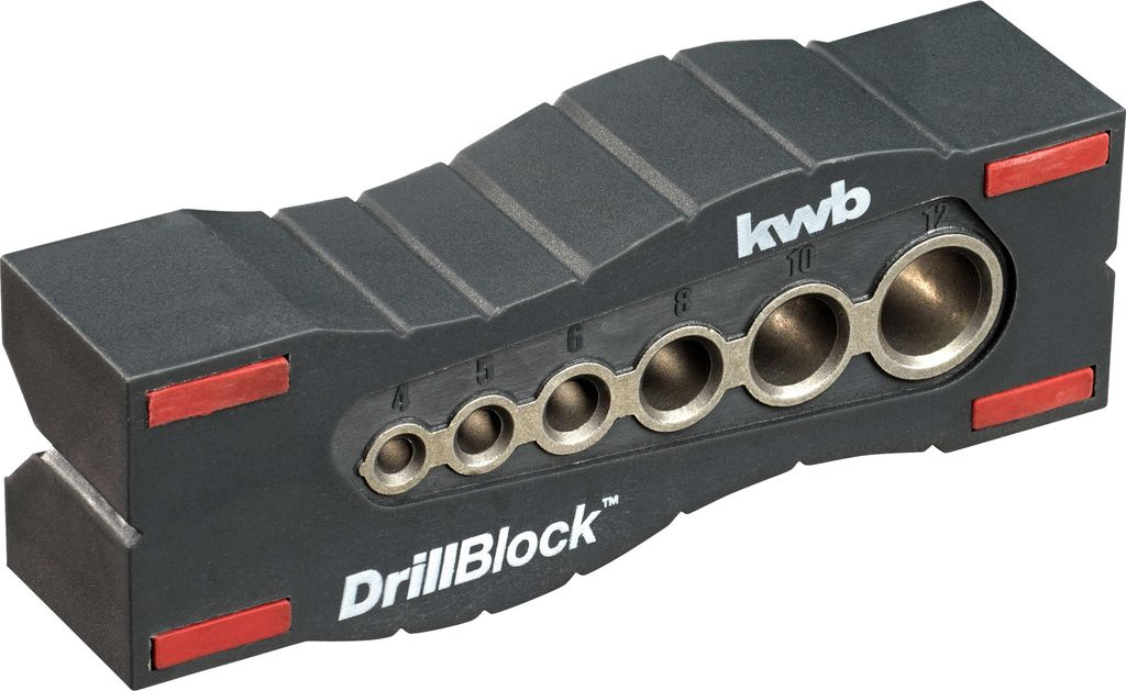 A black drill guide with various sized holes and markings for drilling precise holes.
