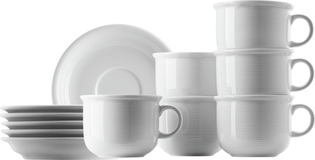 A collection of white ceramic cups and saucers are neatly stacked and arranged against a white background.