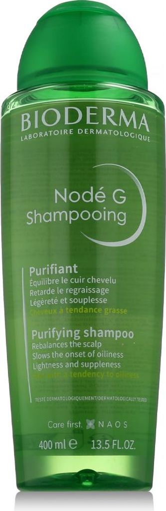 A green bottle of Bioderma Nodé G Purifying Shampoo against a white background.