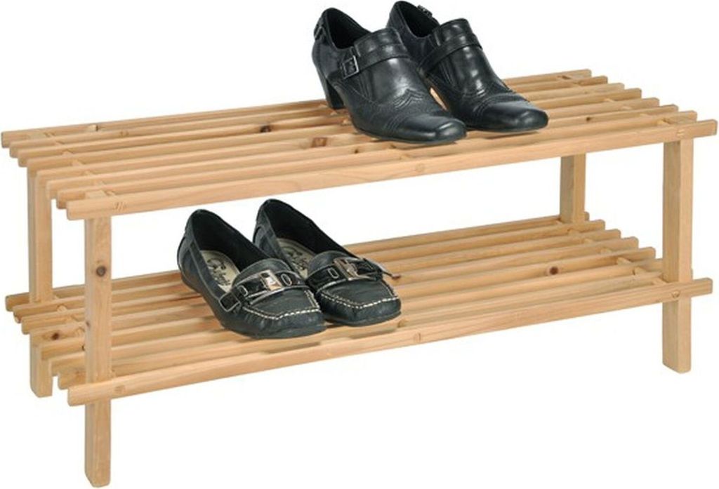 A wooden shoe rack with two shelves, holding two pairs of shoes on each shelf.