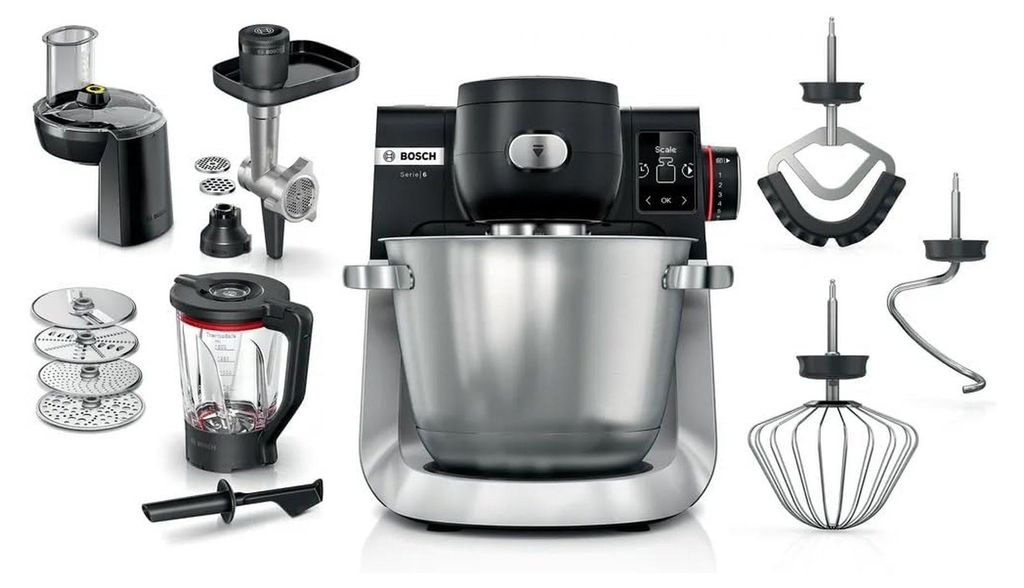 A collection of kitchen appliance attachments and a food processor base are displayed against a white background.