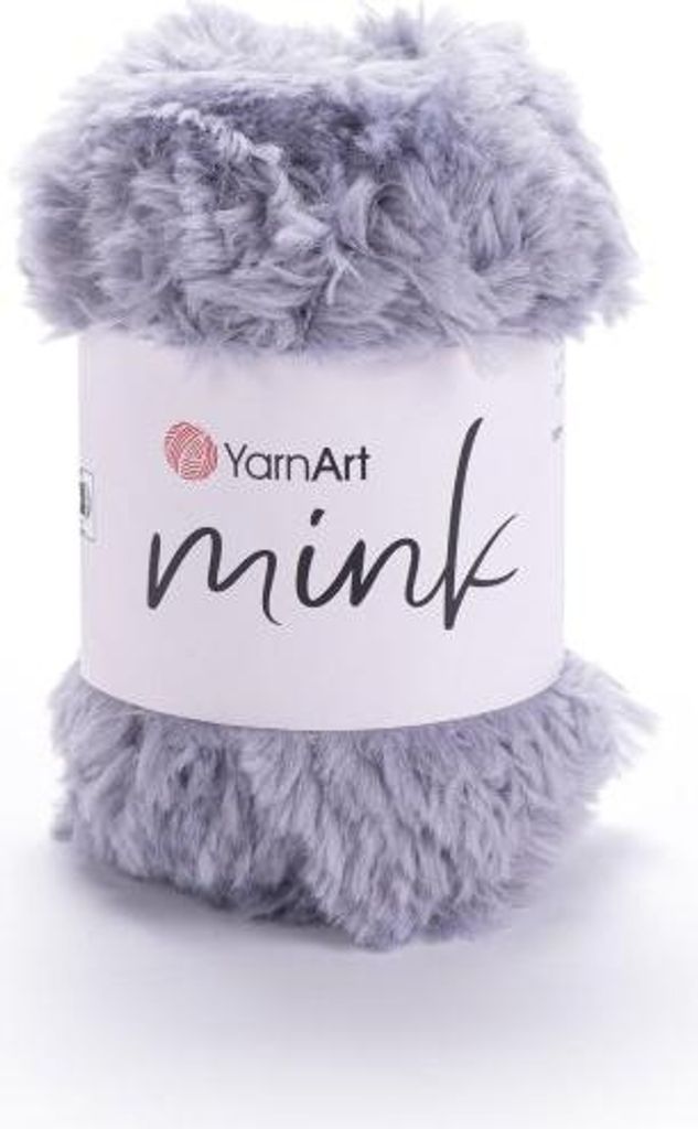 A roll of grey, fuzzy yarn with a white label.