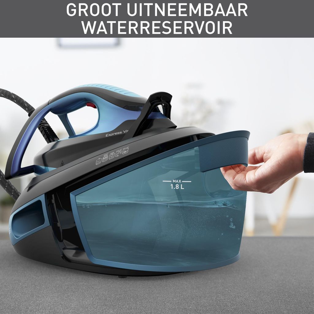 A hand is shown removing the water reservoir from a steam generator iron.