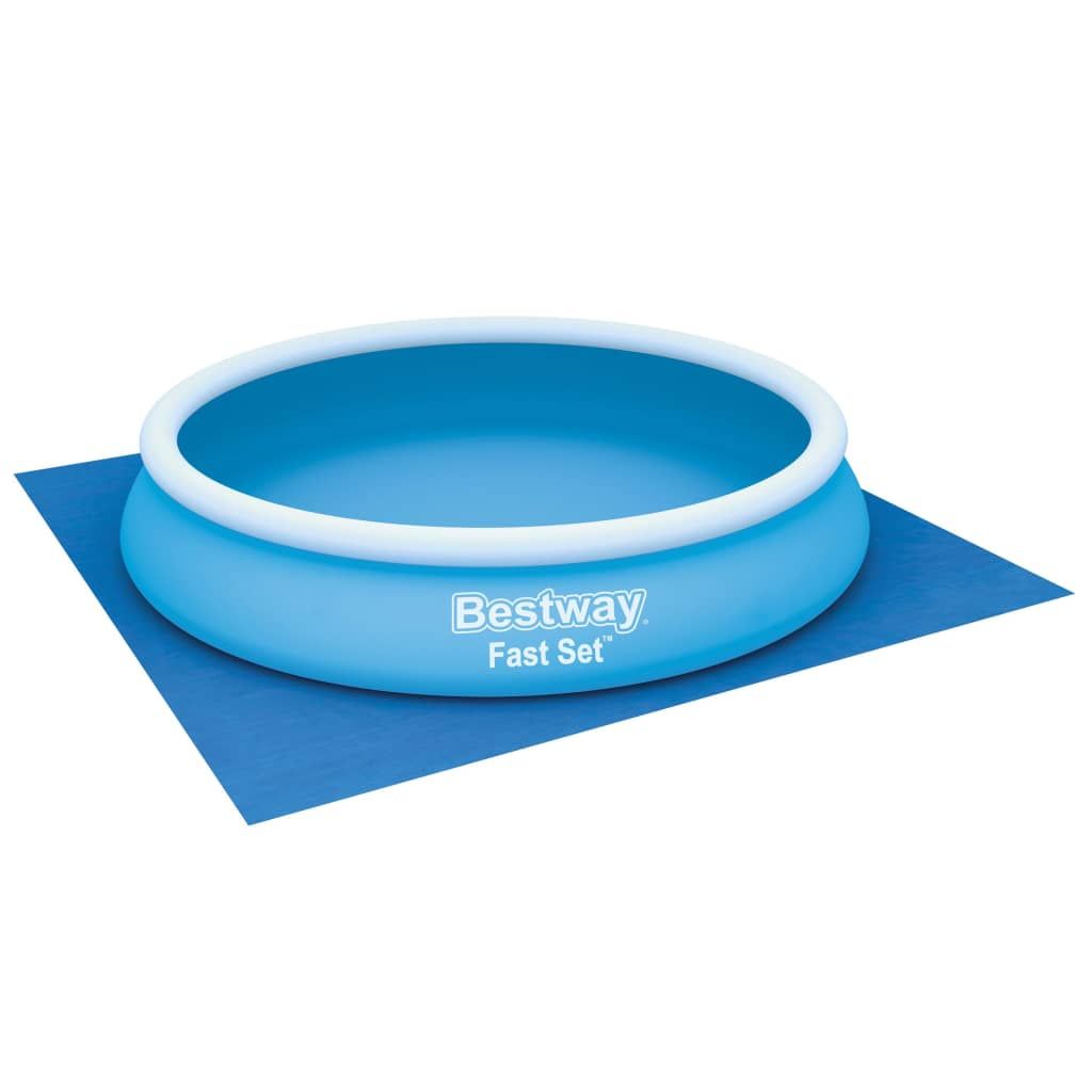A blue inflatable pool with a white rim sits on a blue ground cloth, isolated on a white background.