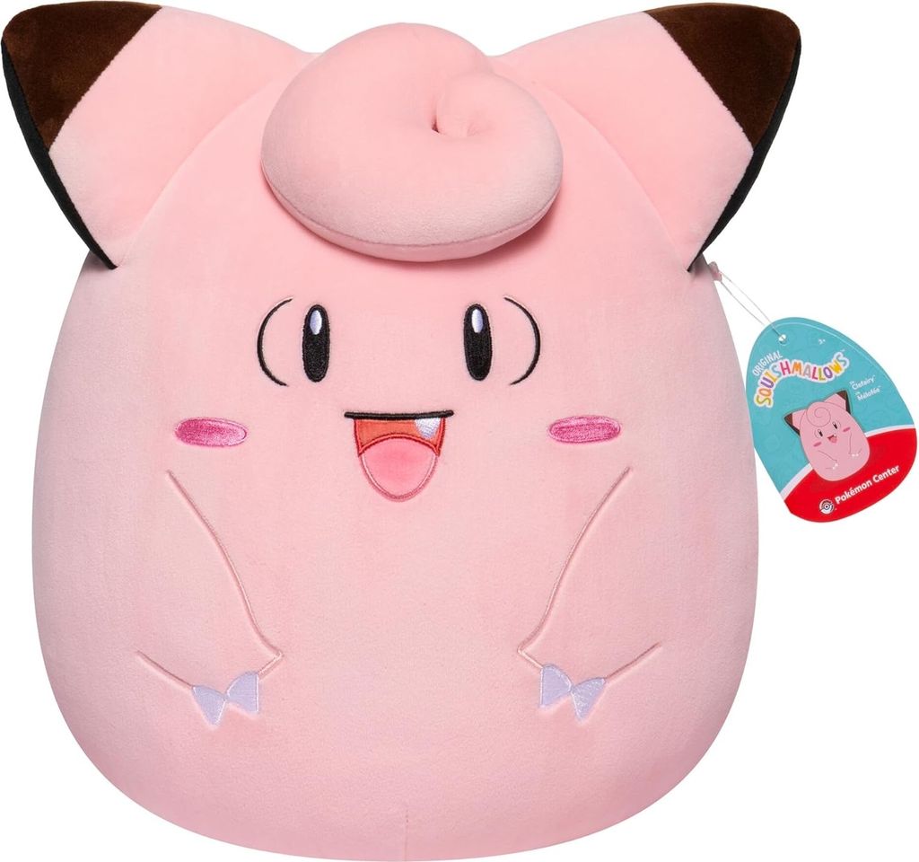 A pink Clefairy Squishmallow plush toy with a tag.