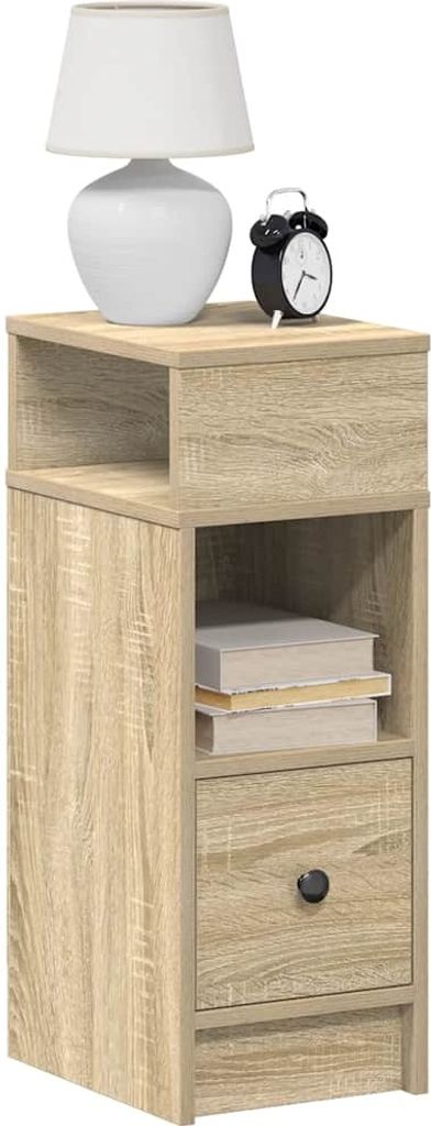 A bedside table with a lamp and an alarm clock on top, and books inside the shelf.