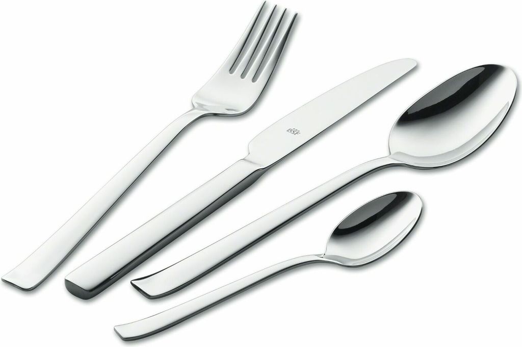 A set of polished stainless steel cutlery, including a fork, knife, and two spoons, arranged diagonally on a white background.