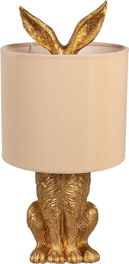 A gold-colored rabbit-shaped table lamp with a beige lampshade.