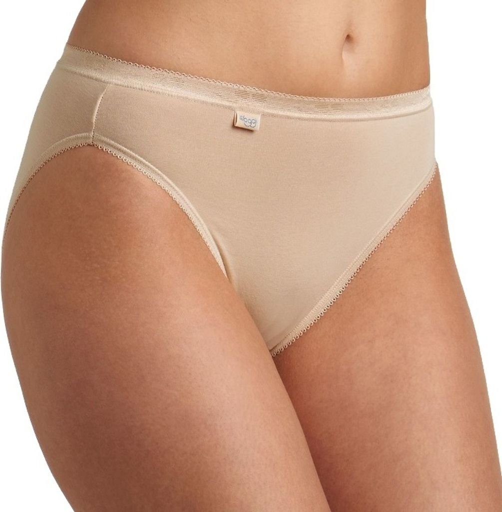 Close-up of a woman's lower torso wearing beige underwear.