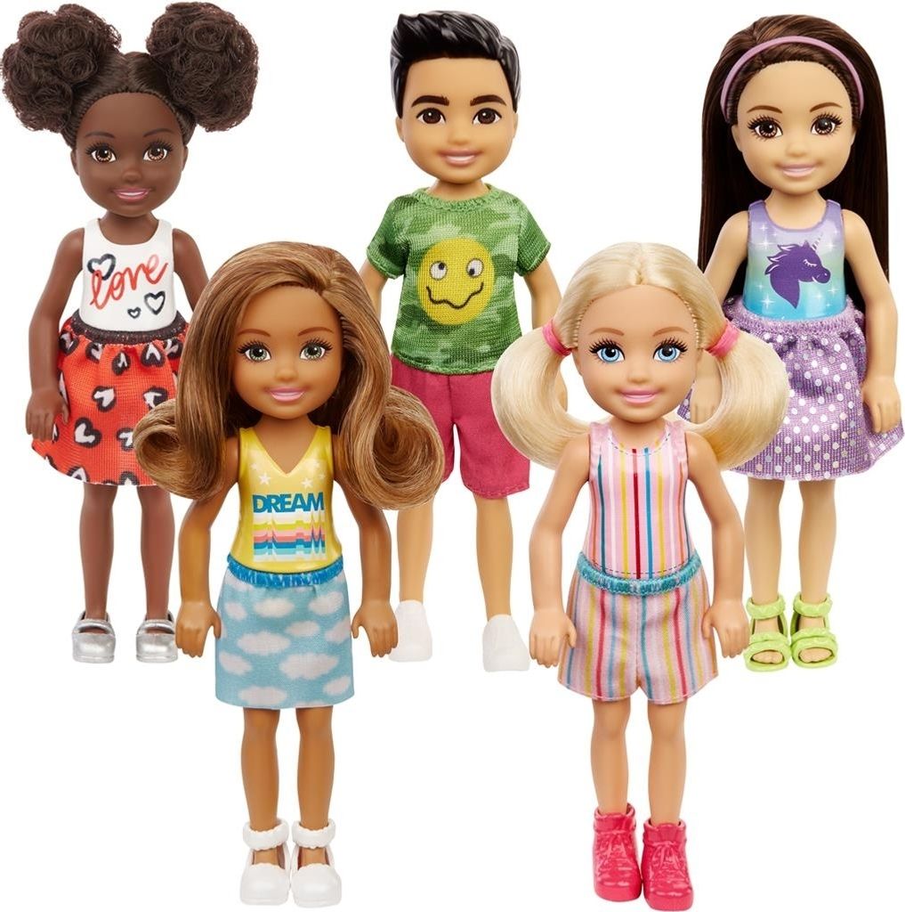 Five children's dolls are standing in front of a white background.