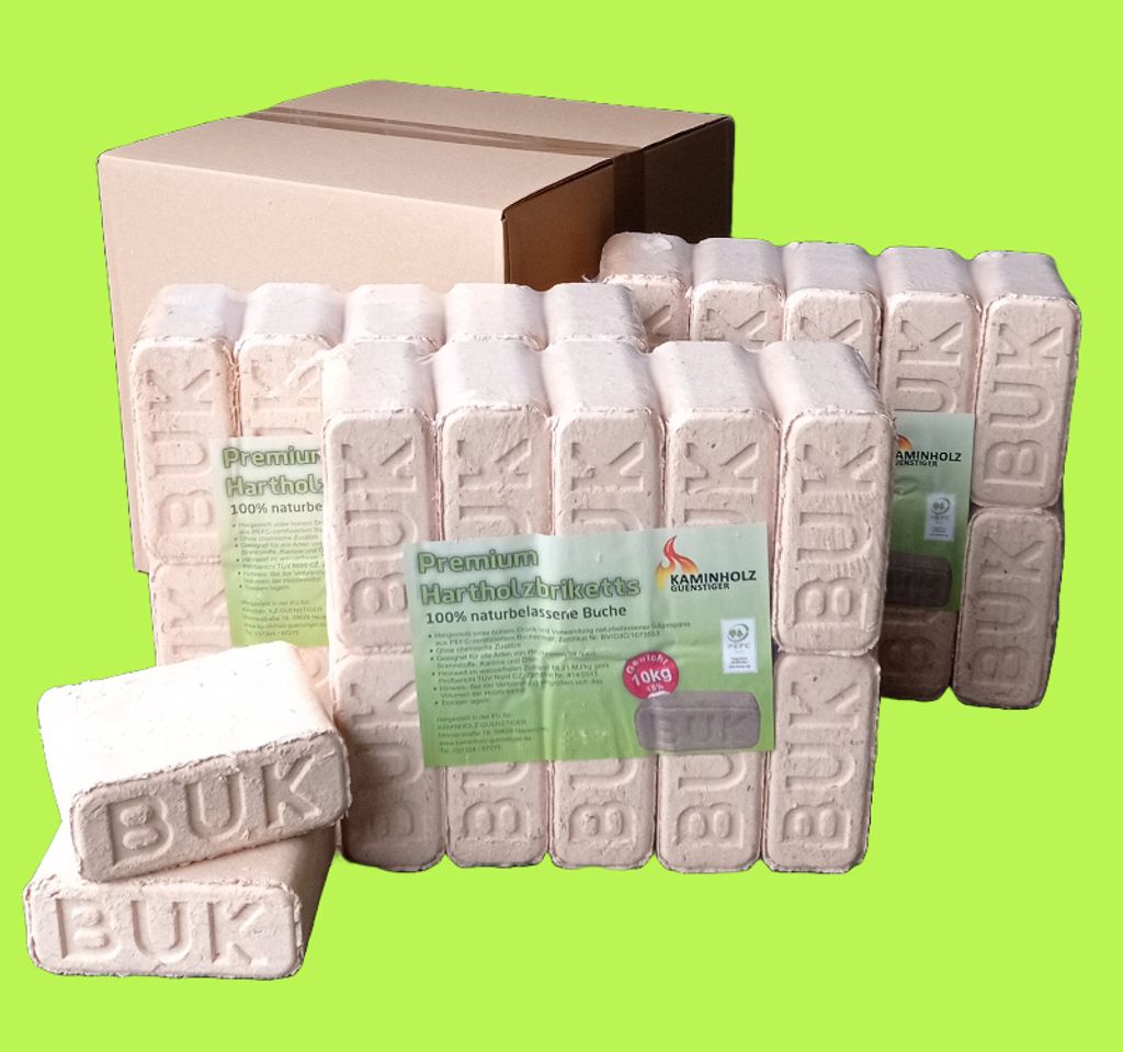 A stack of firewood briquettes in front of an open cardboard box.