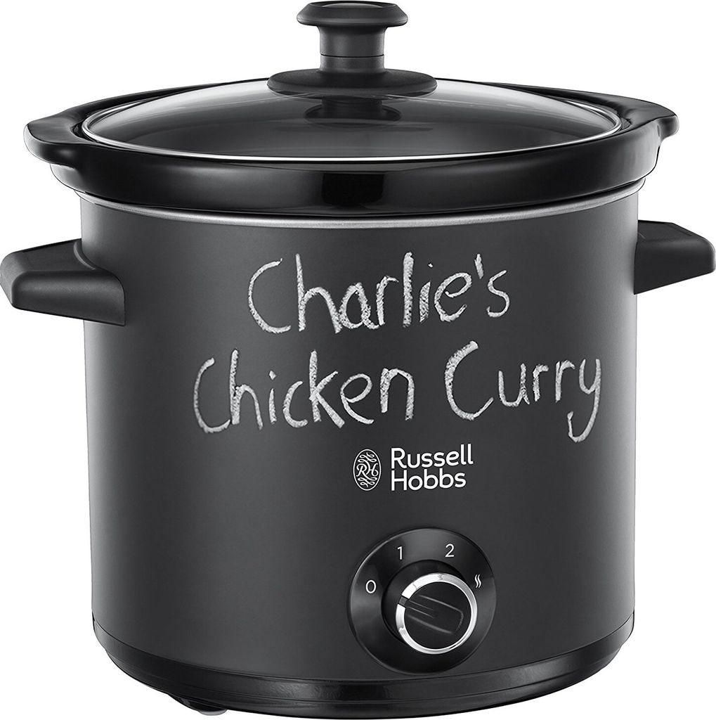 A black slow cooker with "Charlie's Chicken Curry" written on it in chalk.