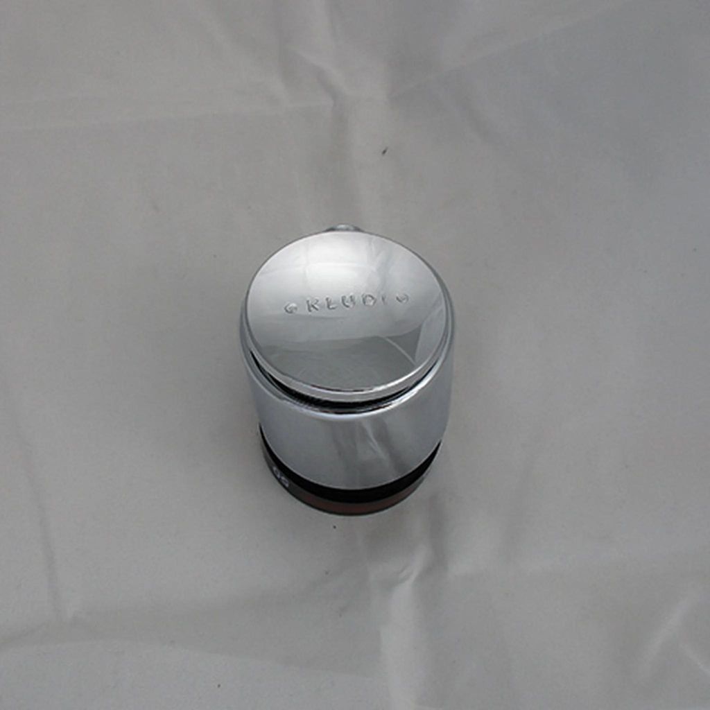 A close-up shot of a chrome-plated temperature selection knob for a faucet.