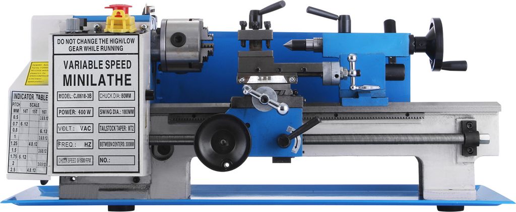 A blue and gray mini metal lathe is shown against a white background. The lathe has various controls and a label with specifications.