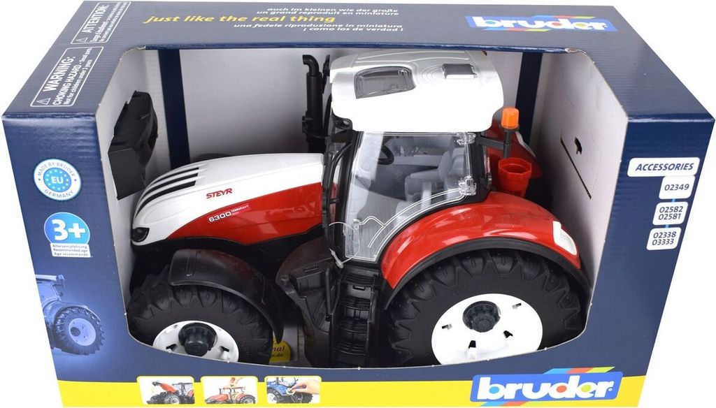 A toy tractor in its retail packaging.