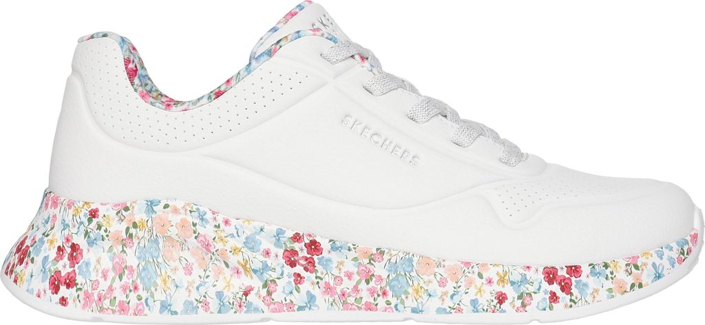 A side view of a single white sneaker with a floral print on the sole and inner lining.