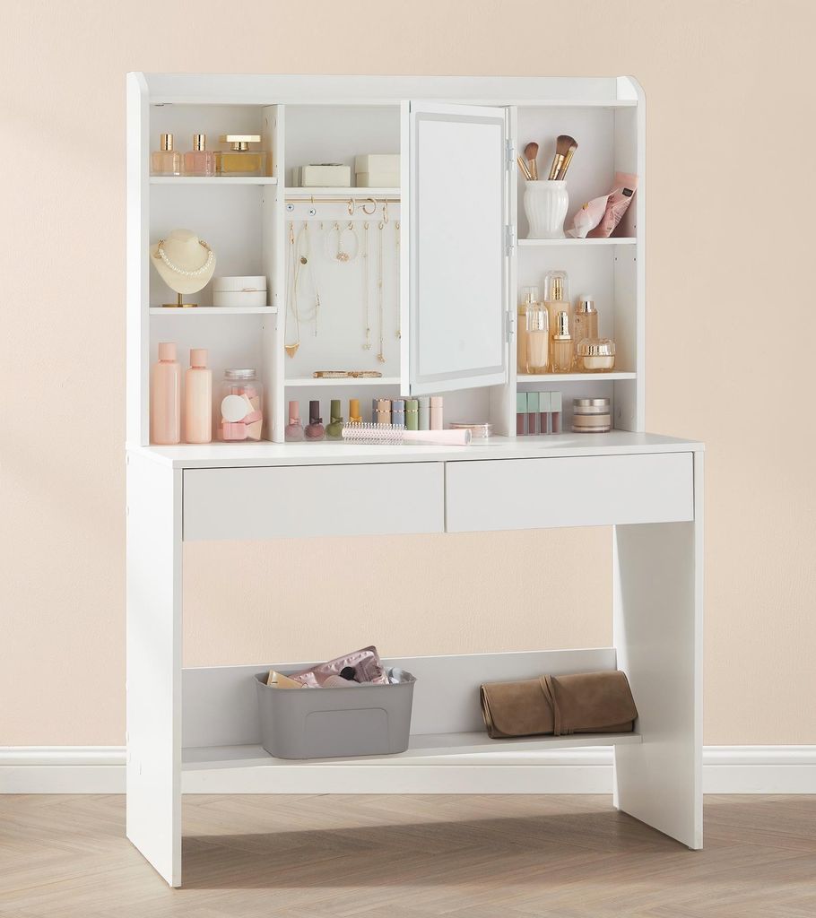 A white vanity table with shelves and drawers, filled with various cosmetic products and accessories.