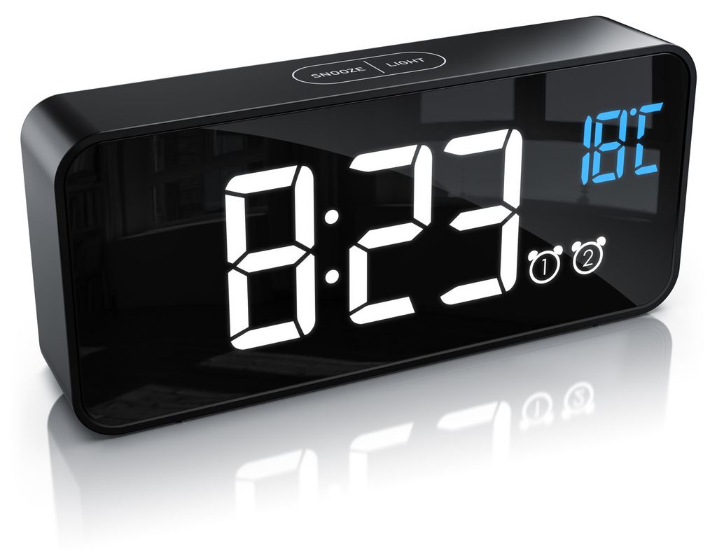 A digital alarm clock with a black casing and a reflective screen displaying the time and temperature.