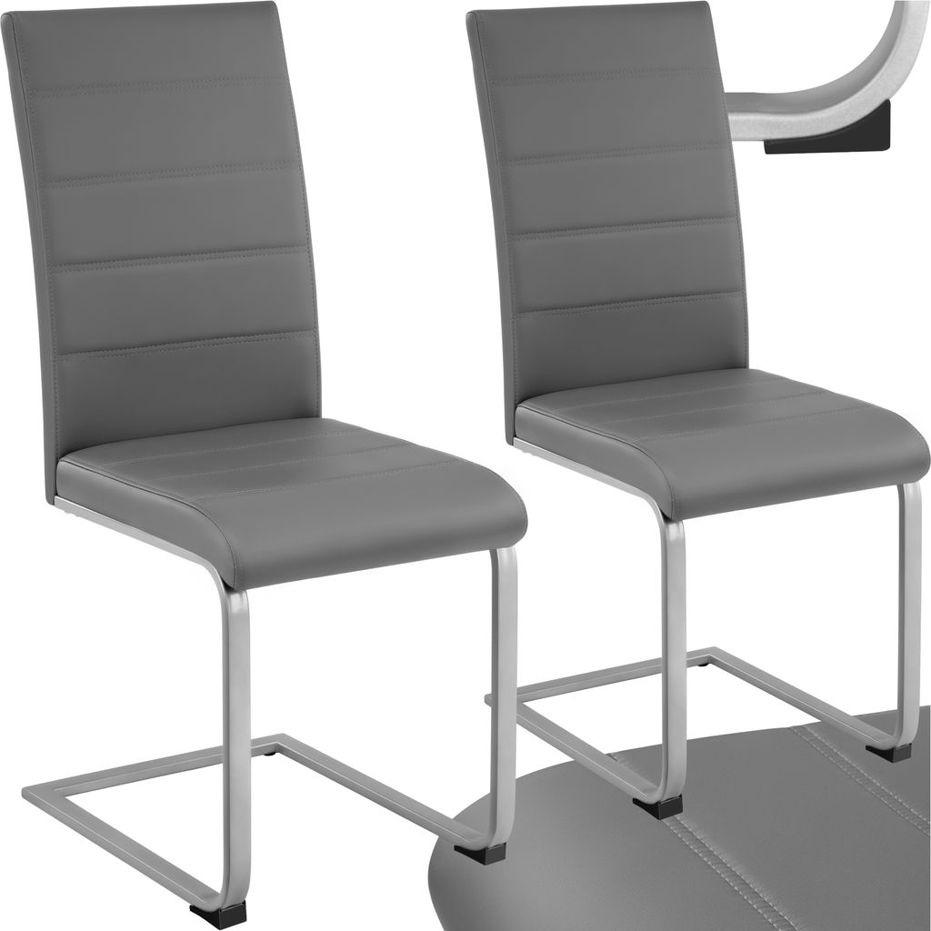 Two gray dining chairs with silver metal frames are shown against a white background.