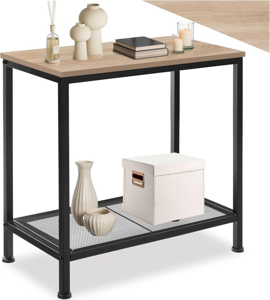A narrow table with a wood-look top and black metal legs, decorated with vases, books, candles, and a storage box.