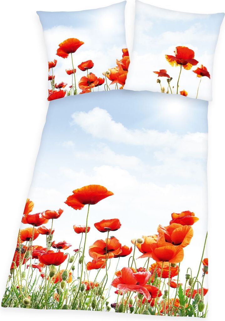 A bedding set with a poppy flower print against a sky background.