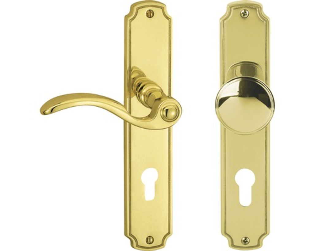 A product shot of a brass door handle set with a keyhole.