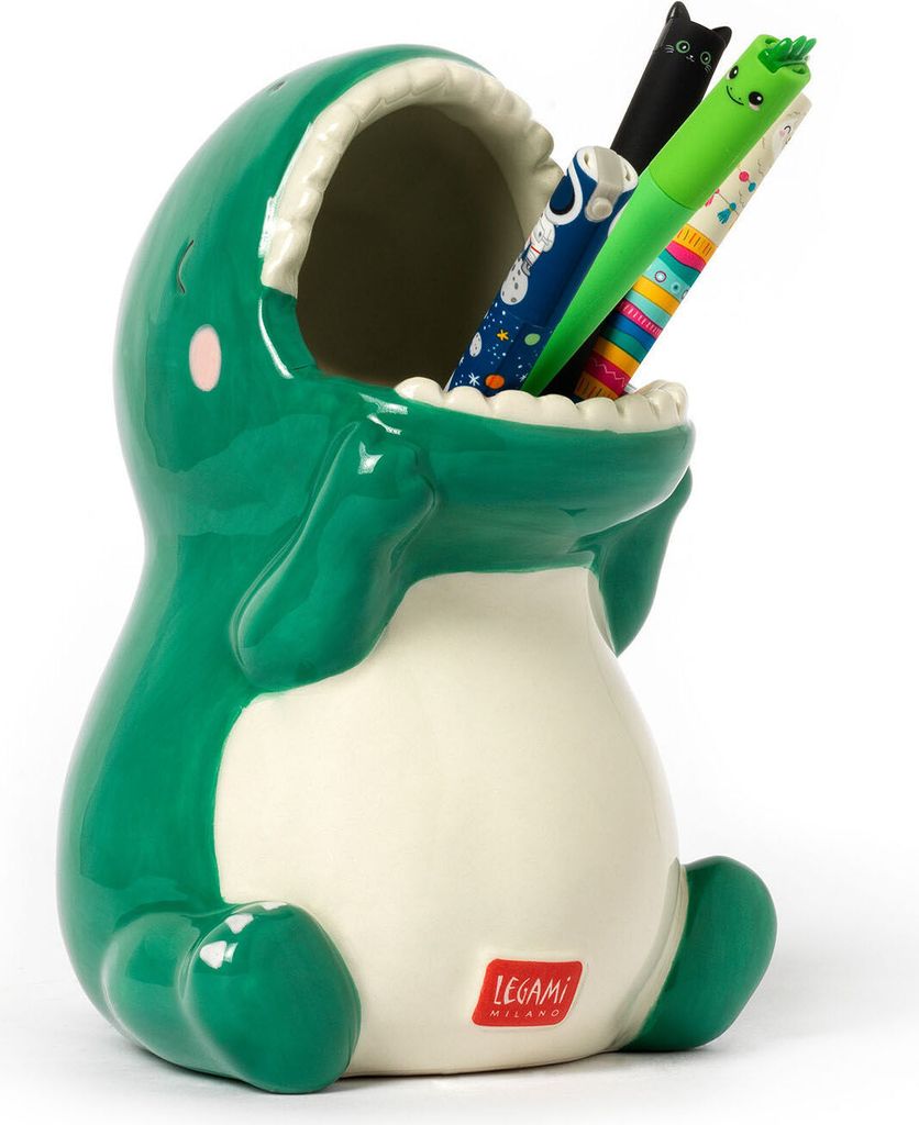 A green ceramic dinosaur pen holder with pens inside, on a white background.