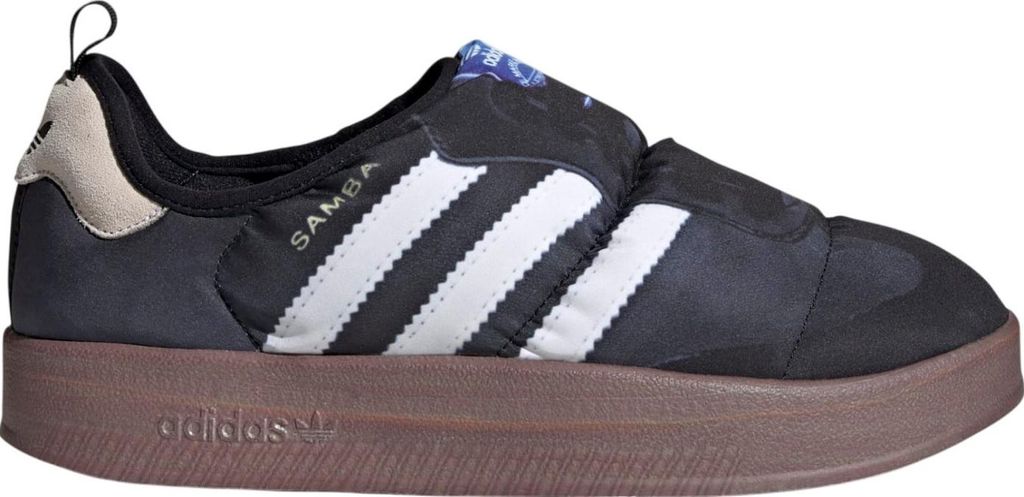 A side view of a black Adidas Puffylette sneaker with white stripes and a brown sole.
