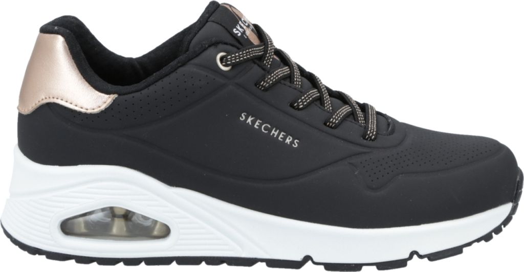 A side view of a black Skechers Uno sneaker with a white sole and rose gold accents.