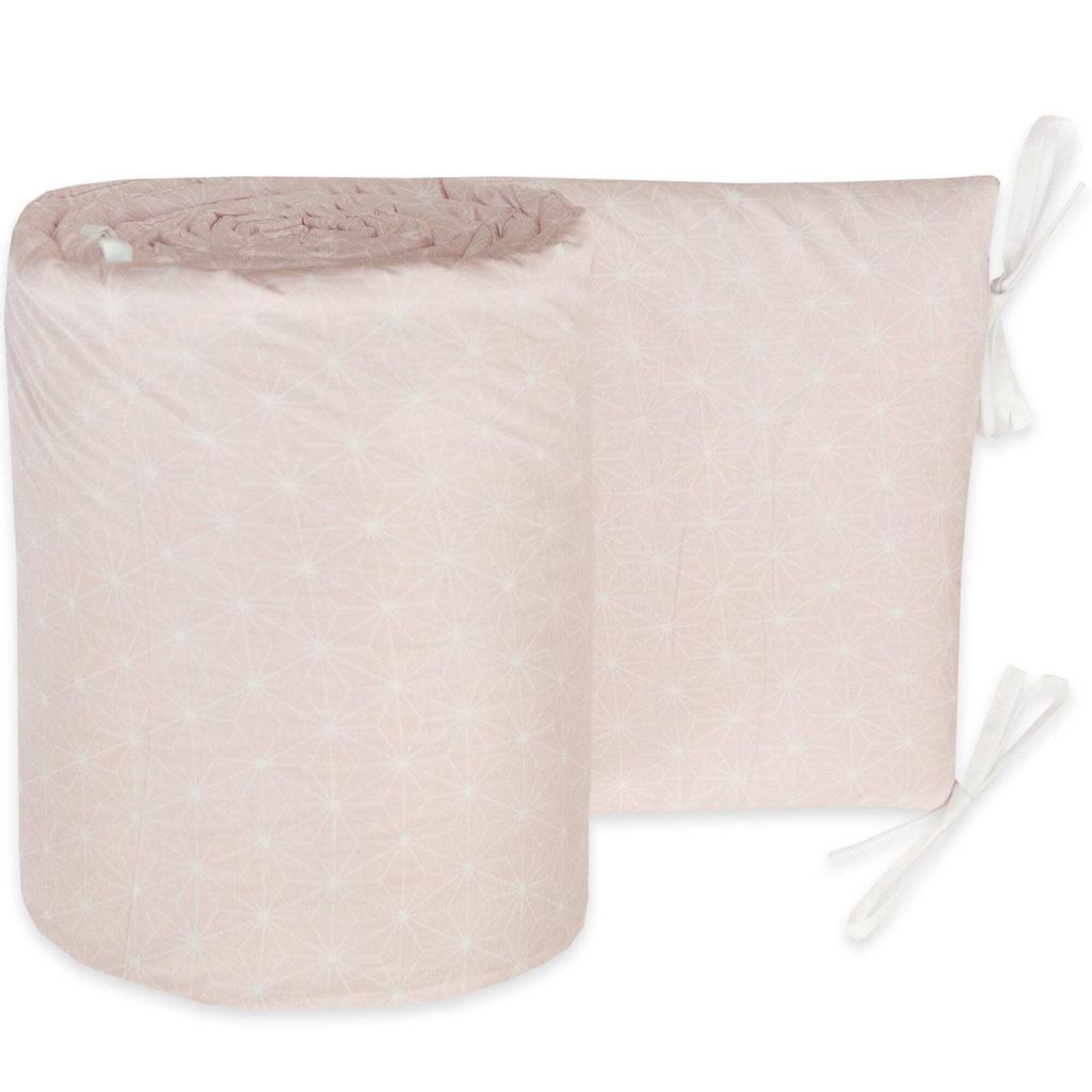 A rolled-up baby crib bumper with a geometric pattern.