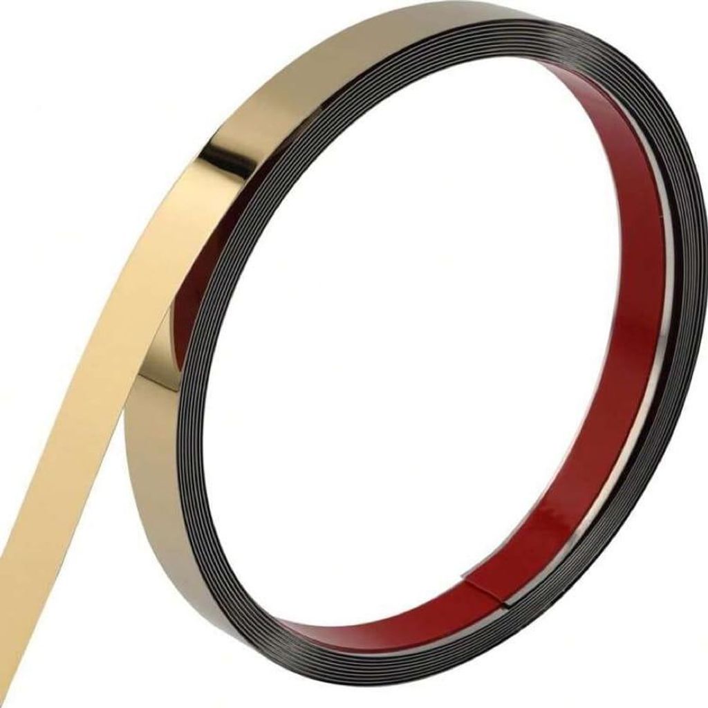 A roll of self-adhesive decorative trim with a gold finish.