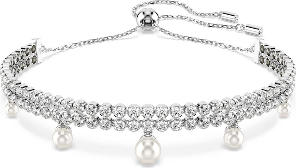 A close-up studio shot of a silver bracelet with pearls and crystals.