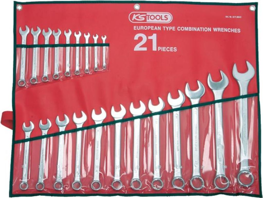 A set of combination wrenches laid out in a red roll-up pouch.
