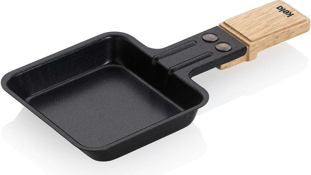 A black raclette pan with a wooden handle is shown against a white background.