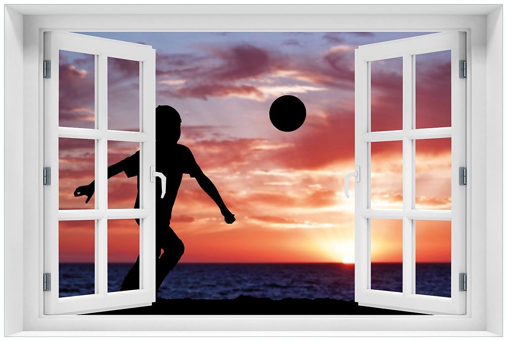 Wallario Premium Glasbild mit Fensterrahmen, freischwebende Optik, kräftige Farben, Größe 60 x 90 cm Motiv Fußball - Kleiner Junge spielt im Ab...