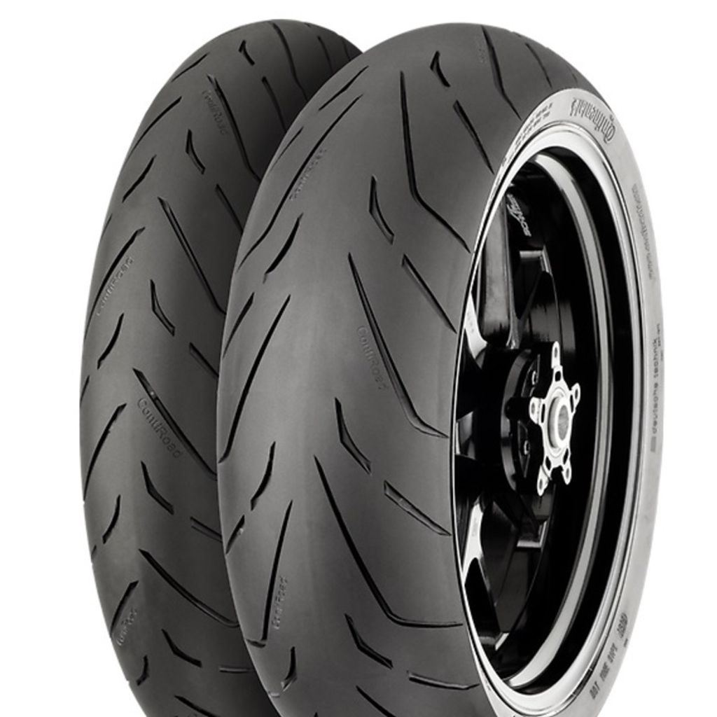 Two motorcycle tires are shown, one mounted on a black rim.
