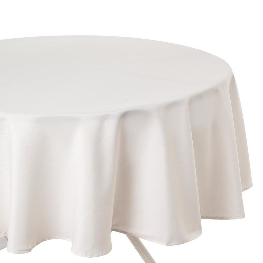A close-up of a round, white tablecloth draped over a table.